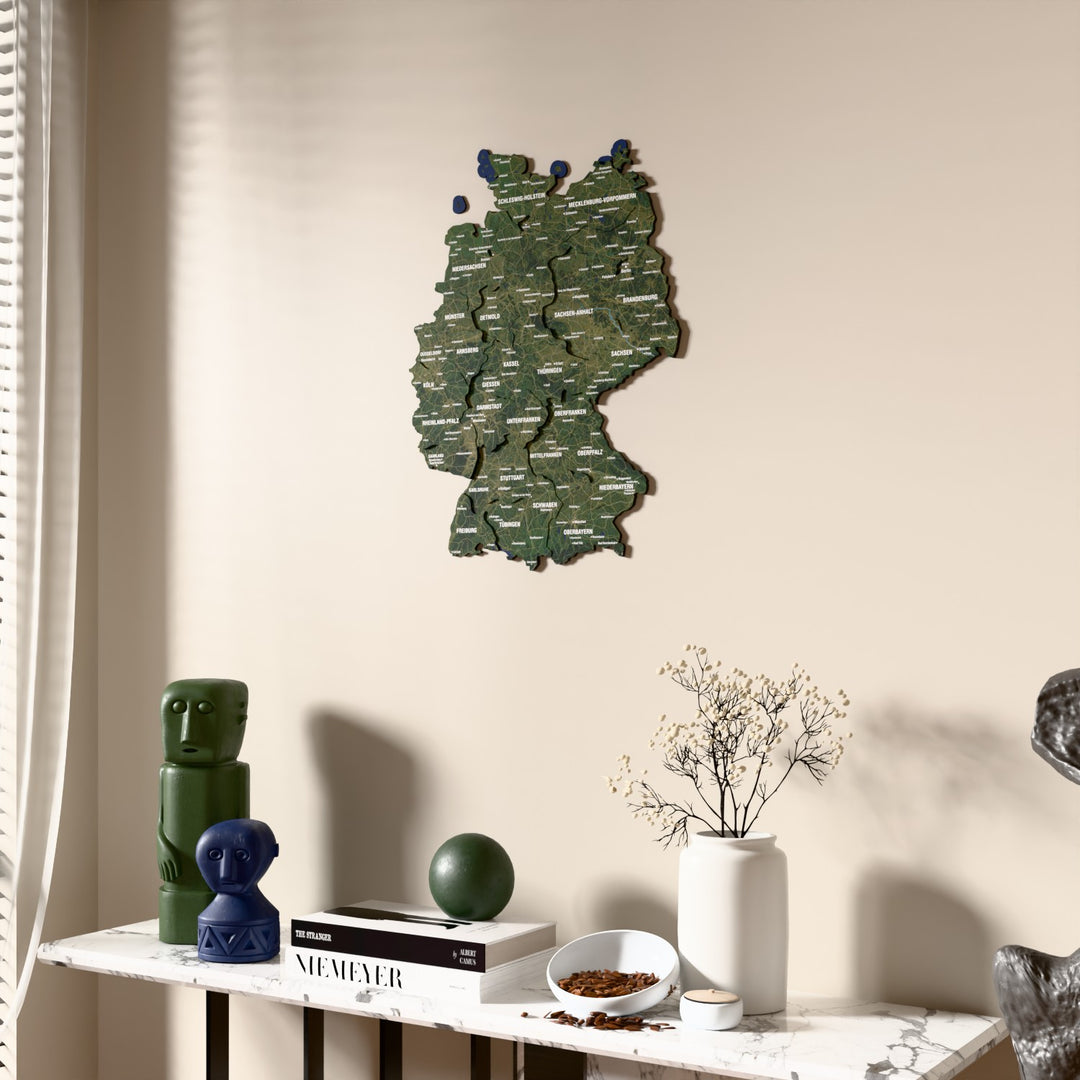 Satellite Germany wooden wall map beside a sheer curtain, angled view