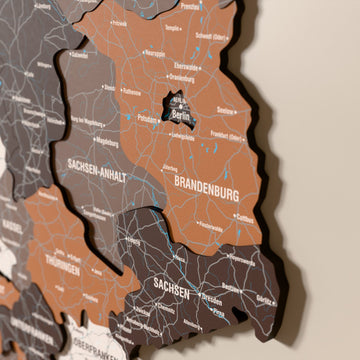 Close-up of the Soil Germany wooden wall map with layered regions and printed names