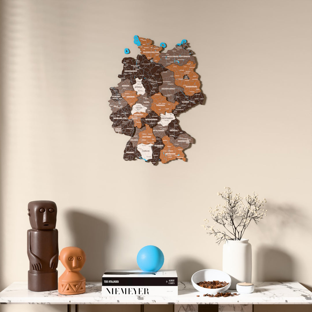 Soil Germany wooden wall map above a marble console, front view