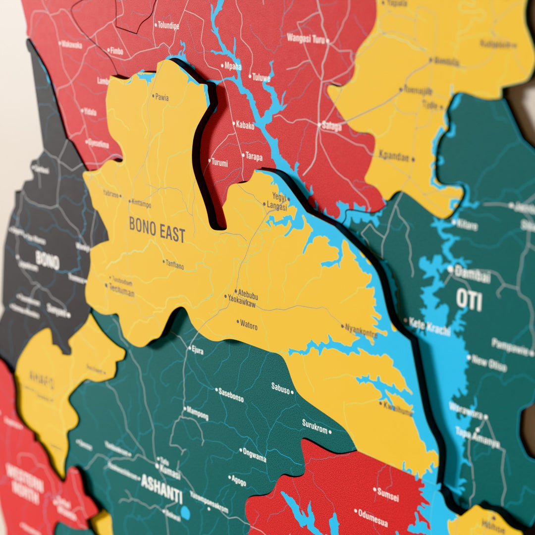 Close-up of the Flag colored Ghana wooden wall map with layered regions and printed names