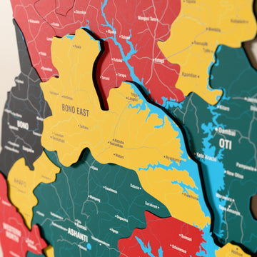 Close-up of the Flag colored Ghana wooden wall map with layered regions and printed names