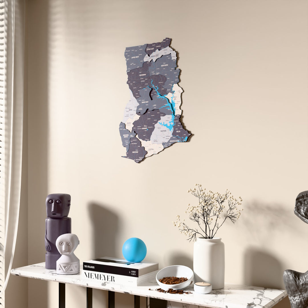 Nimbus Ghana wooden wall map beside a sheer curtain, angled view