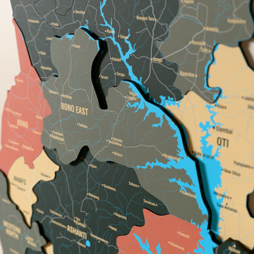 Close-up of the Sage Ghana wooden wall map with layered regions and printed names