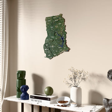 Satellite Ghana wooden wall map beside a sheer curtain, angled view
