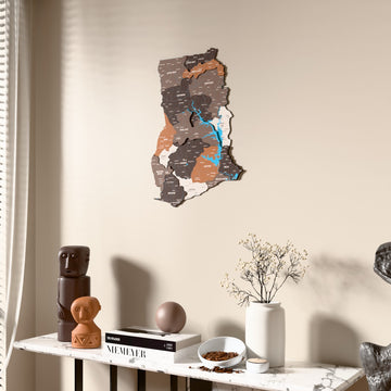 Soil Ghana wooden wall map beside a sheer curtain, angled view