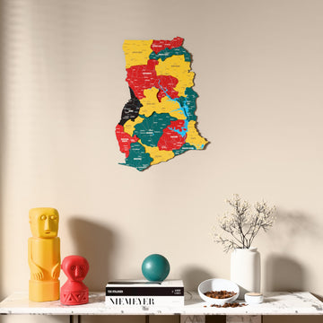 Flag colored Ghana wooden wall map above a marble console, front view