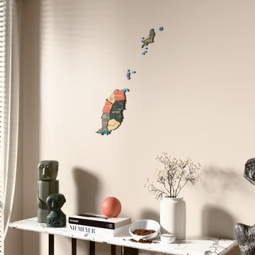 Sage Grenada wooden wall map beside a sheer curtain, angled view