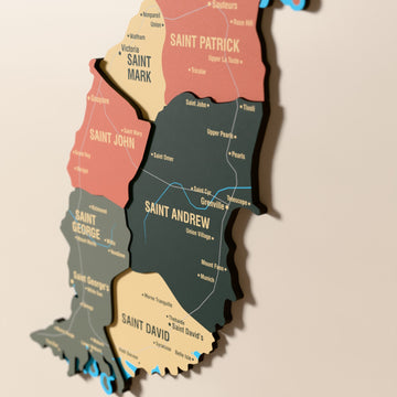 Close-up of the Sage Grenada wooden wall map with layered regions and printed names
