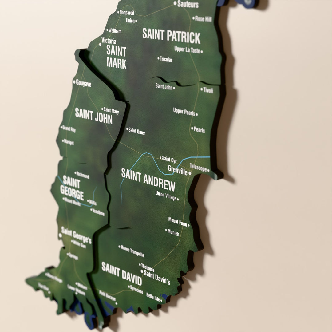 Close-up of the Satellite Grenada wooden wall map with layered regions and printed names