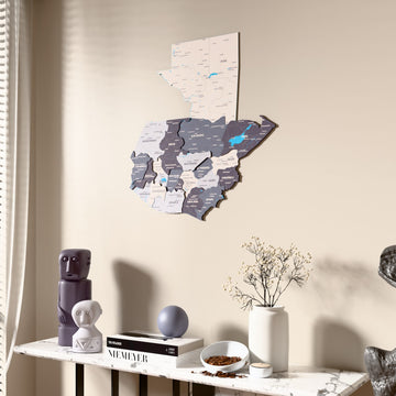 Nimbus Guatemala wooden wall map beside a sheer curtain, angled view