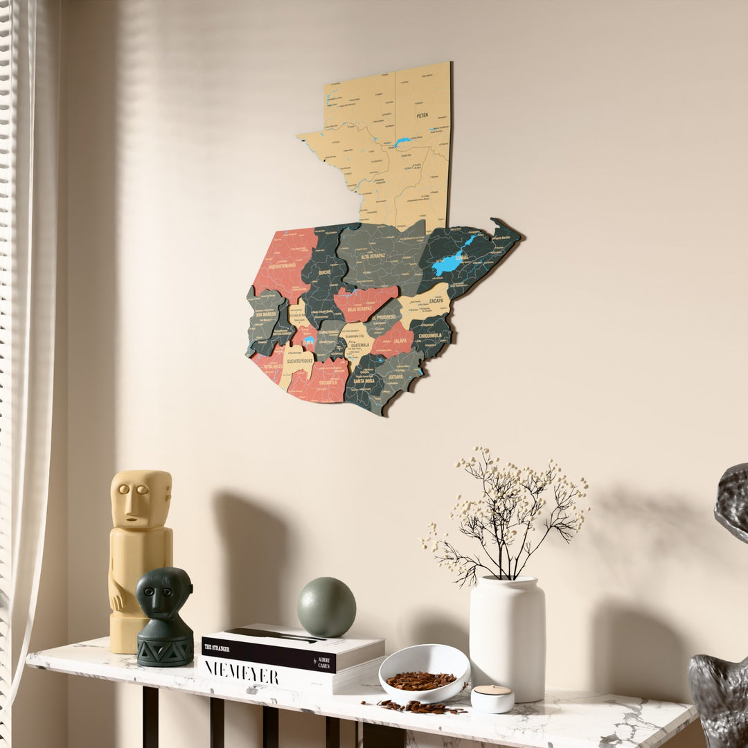 Sage Guatemala wooden wall map beside a sheer curtain, angled view