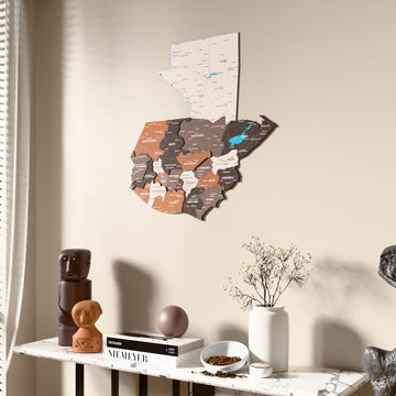 Soil Guatemala wooden wall map beside a sheer curtain, angled view