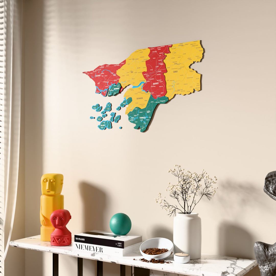 Flag colored Guinea-Bissau wooden wall map beside a sheer curtain, angled view
