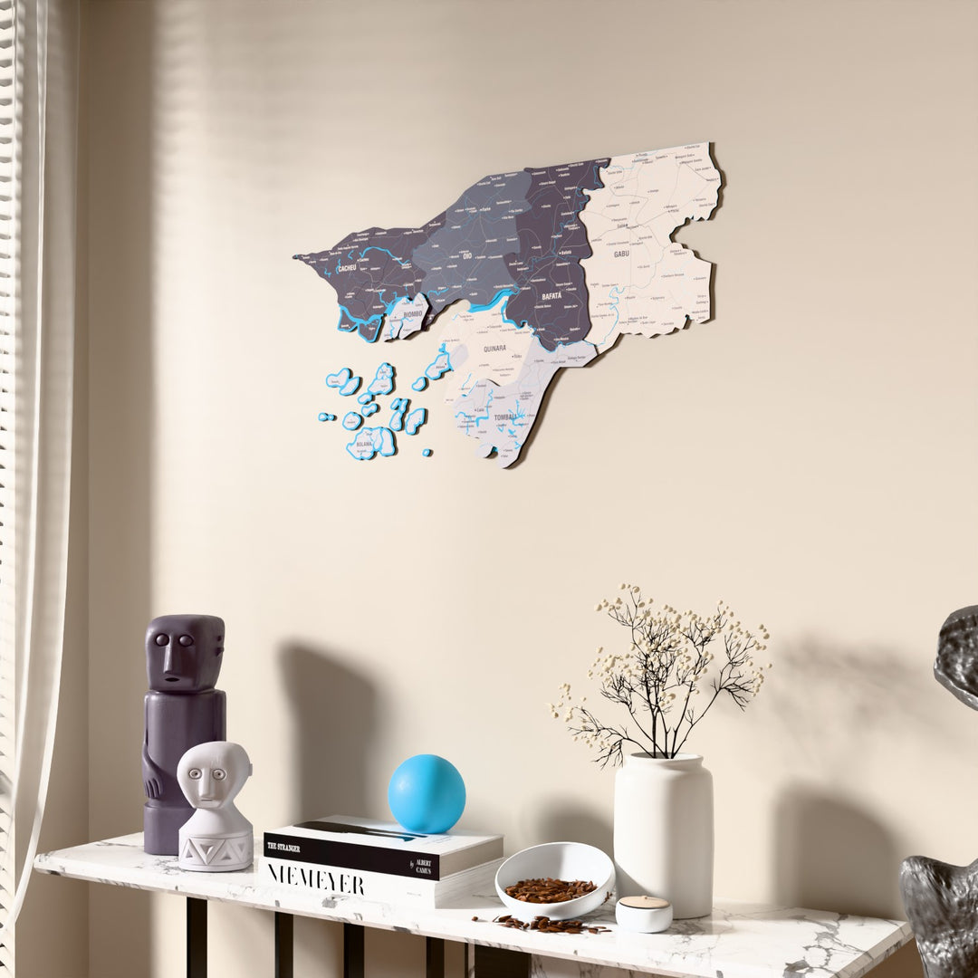 Nimbus Guinea-Bissau wooden wall map beside a sheer curtain, angled view