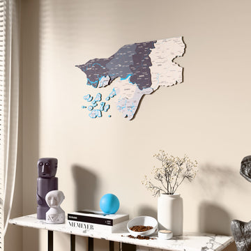 Nimbus Guinea-Bissau wooden wall map beside a sheer curtain, angled view
