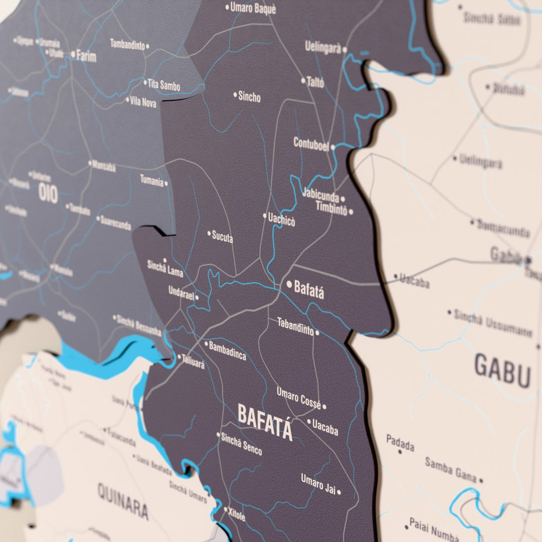Close-up of the Nimbus Guinea-Bissau wooden wall map with layered regions and printed names