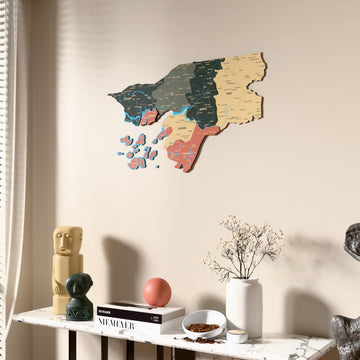 Sage Guinea-Bissau wooden wall map beside a sheer curtain, angled view