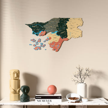 Sage Guinea-Bissau wooden wall map above a marble console, front view