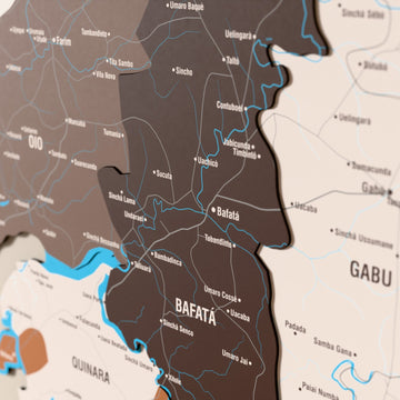 Close-up of the Soil Guinea-Bissau wooden wall map with layered regions and printed names