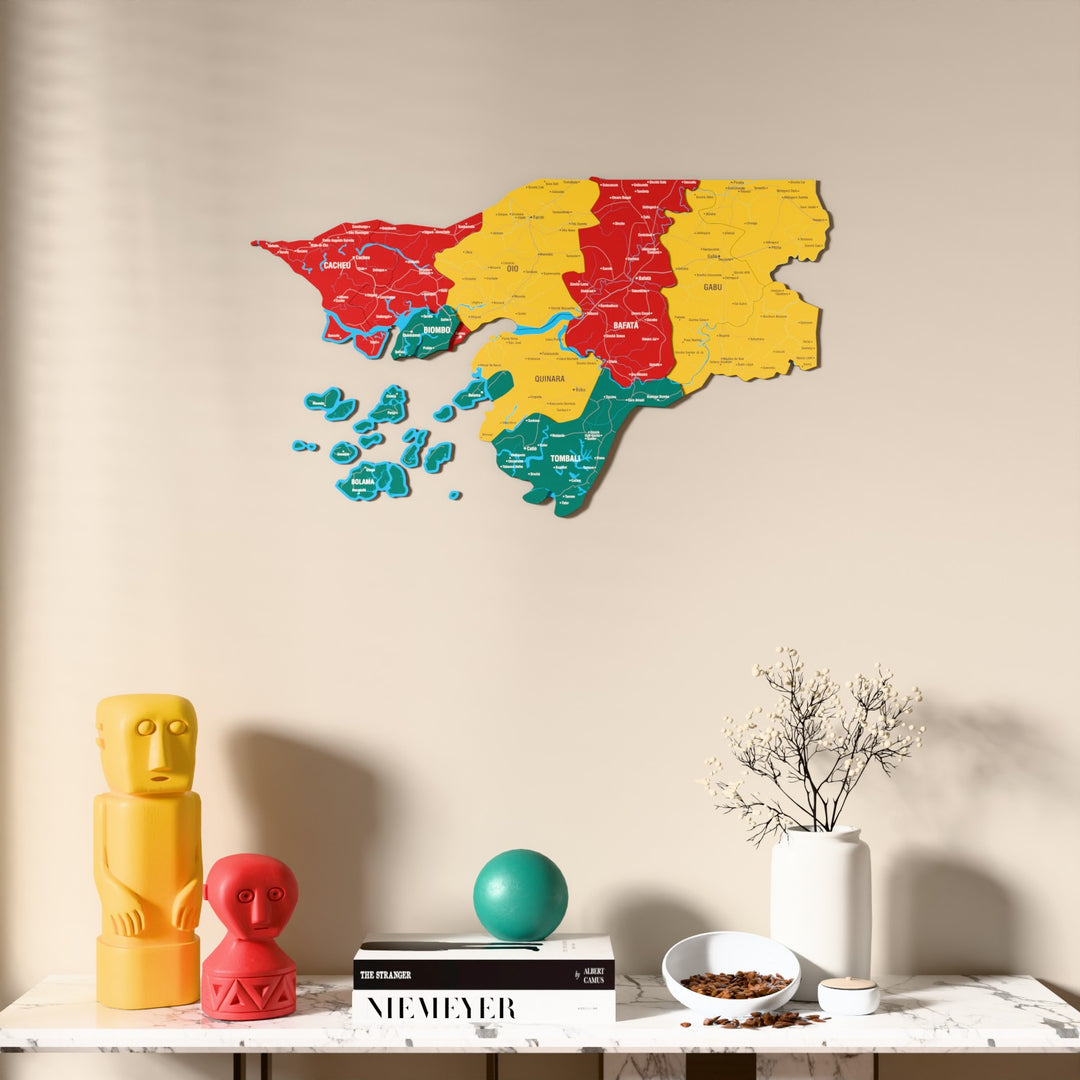 Flag colored Guinea-Bissau wooden wall map above a marble console, front view