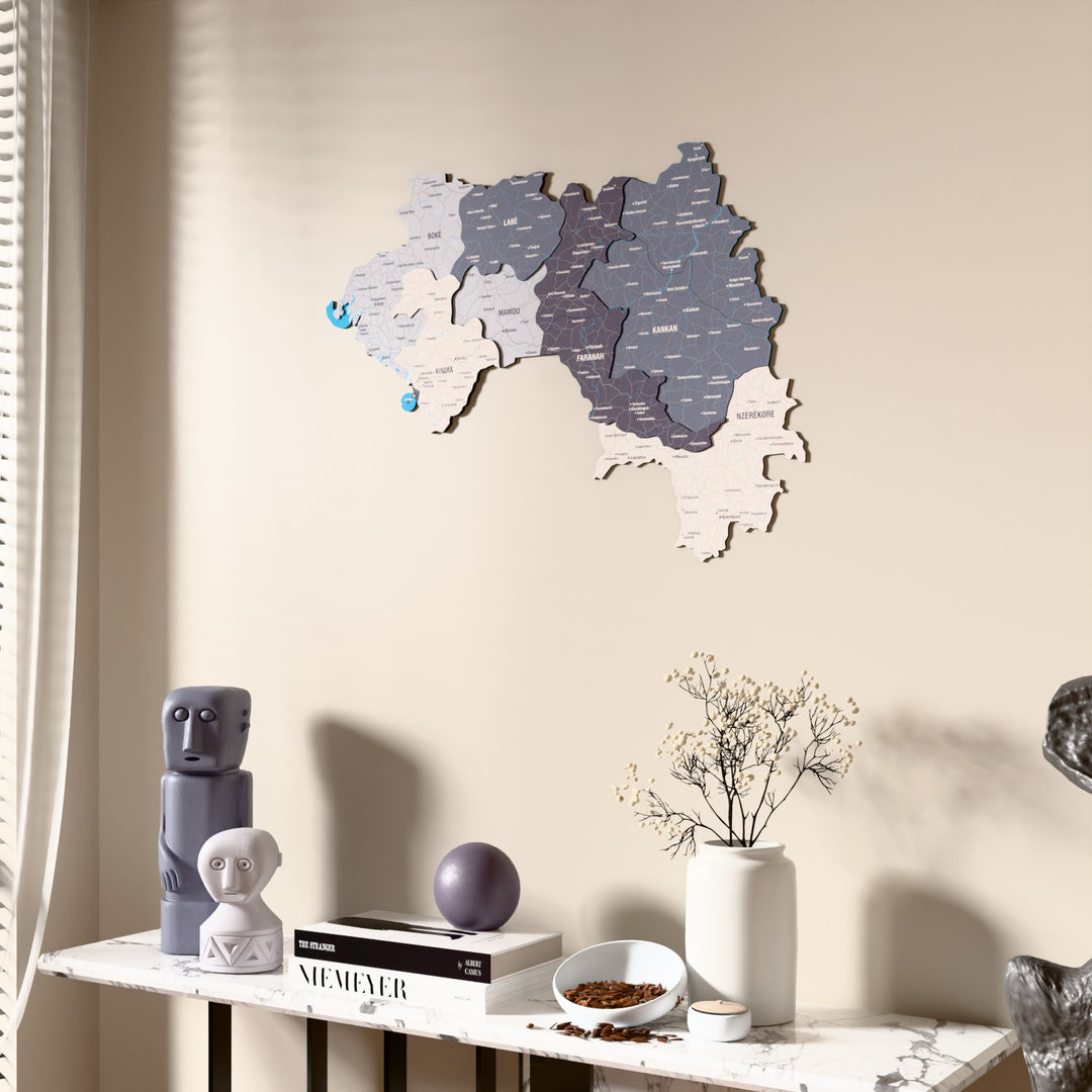 Nimbus Guinea wooden wall map beside a sheer curtain, angled view