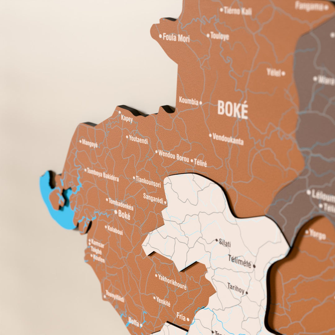 Close-up of the Soil Guinea wooden wall map with layered regions and printed names