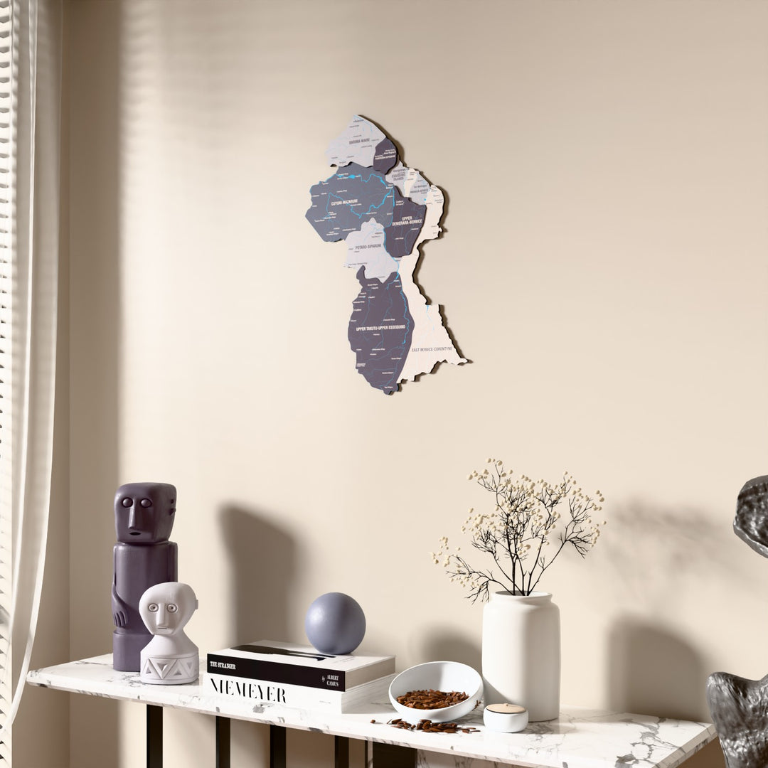 Nimbus Guyana wooden wall map beside a sheer curtain, angled view