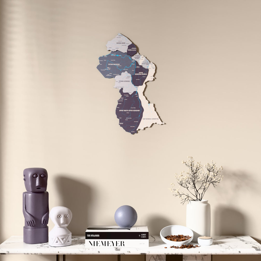 Nimbus Guyana wooden wall map above a marble console, front view