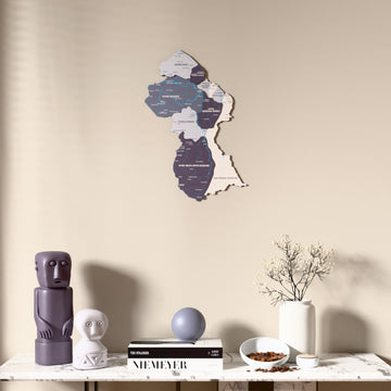 Nimbus Guyana wooden wall map above a marble console, front view