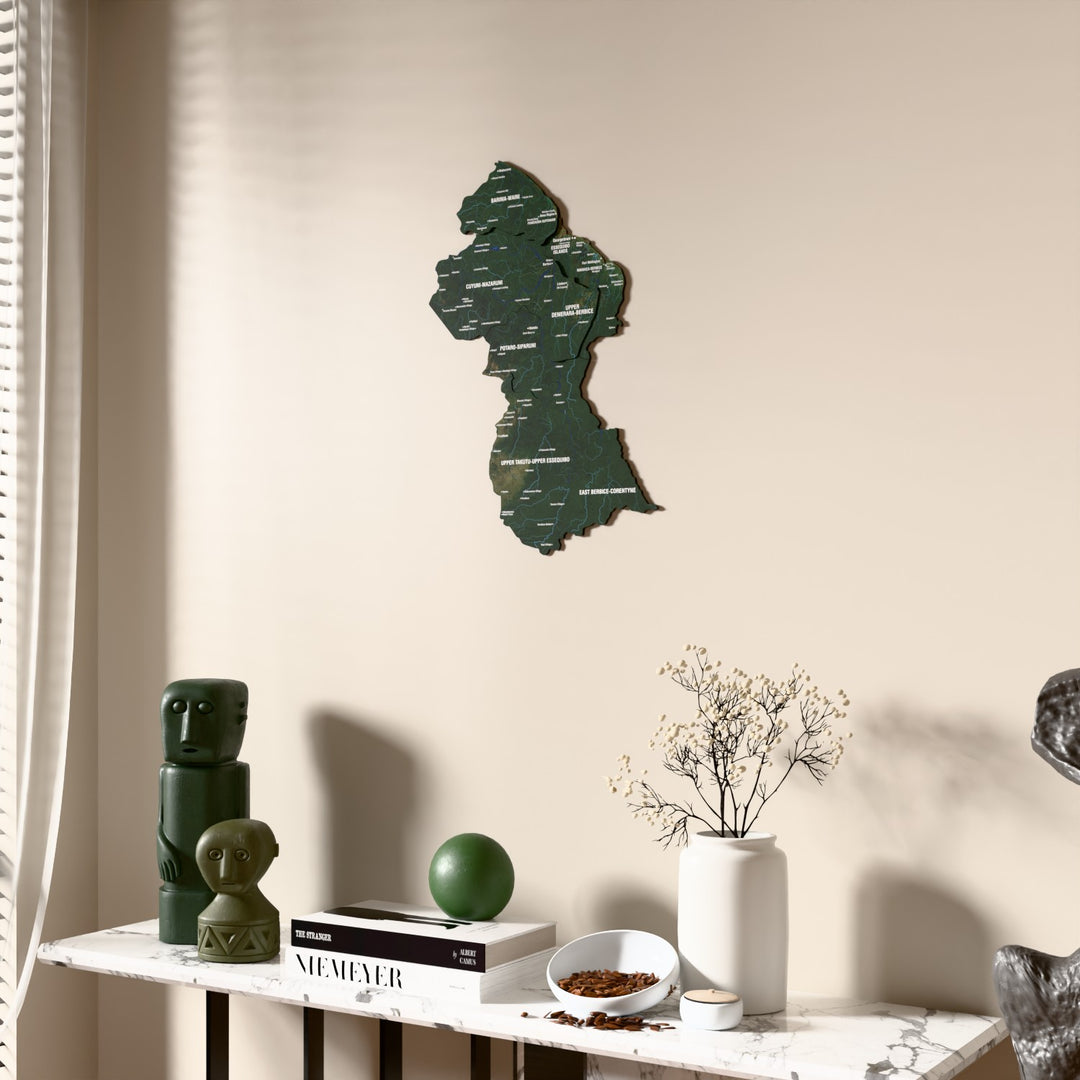 Satellite Guyana wooden wall map beside a sheer curtain, angled view