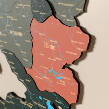 Close-up of the Sage Haiti wooden wall map with layered regions and printed names