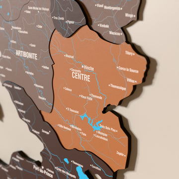 Close-up of the Soil Haiti wooden wall map with layered regions and printed names