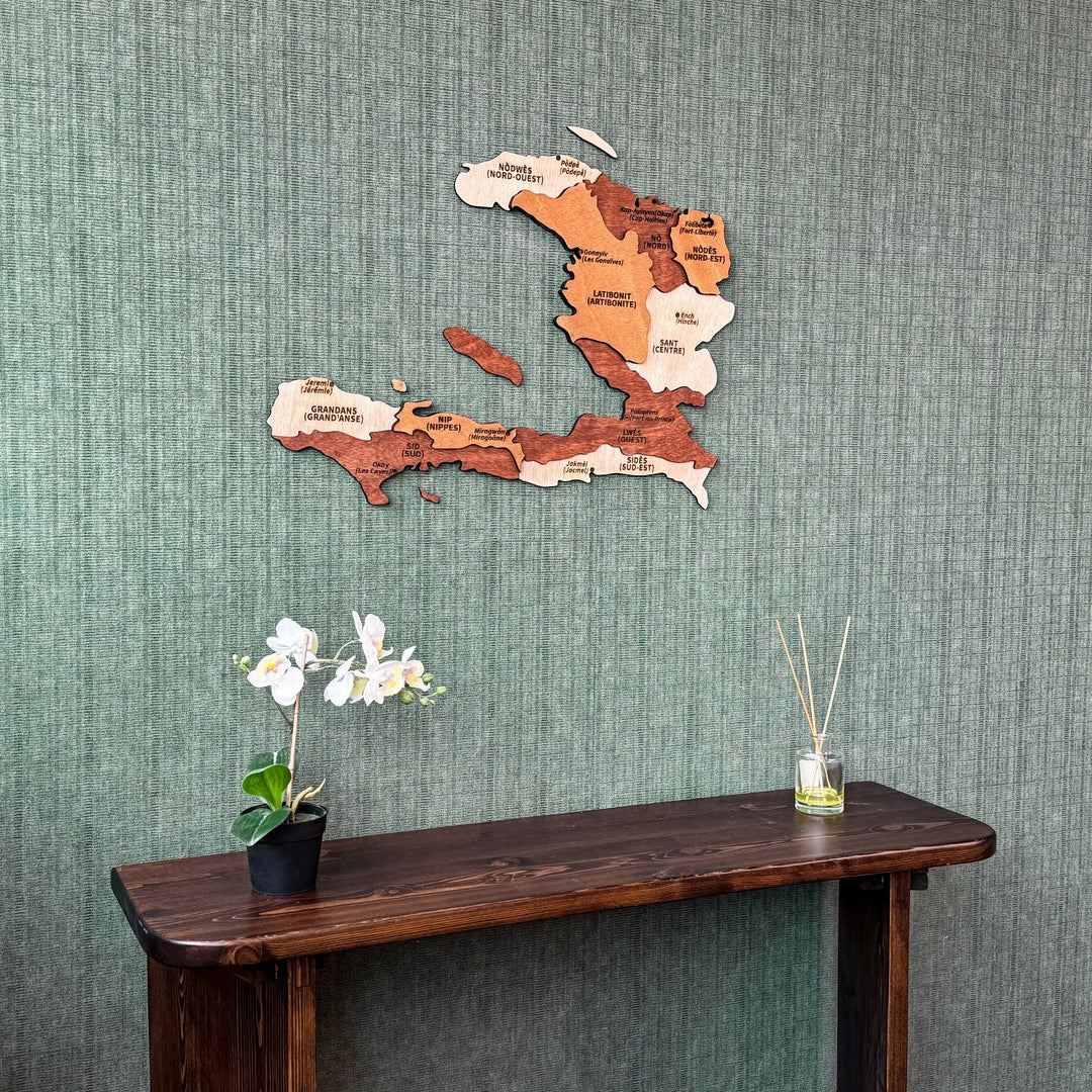 Haiti plywood wall map above a dark console with an orchid, closer view