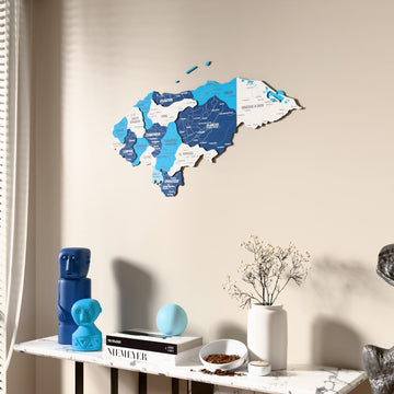 Flag colored Honduras wooden wall map beside a sheer curtain, angled view