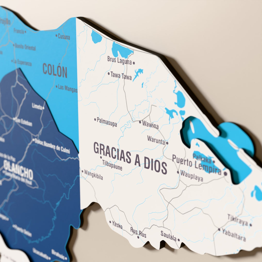 Close-up of the Flag colored Honduras wooden wall map with layered regions and printed names