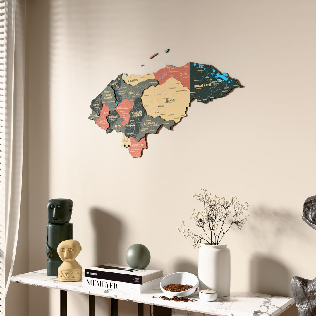 Sage Honduras wooden wall map beside a sheer curtain, angled view