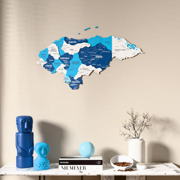 Flag colored Honduras wooden wall map above a marble console, front view