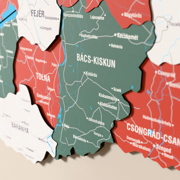 Close-up of the Flag colored Hungary wooden wall map with layered regions and printed names