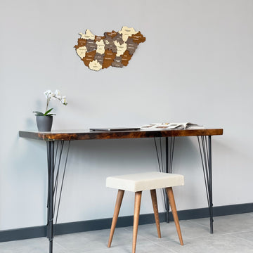 Wooden Hungary map above a narrow desk with a stool, wide view of the wall