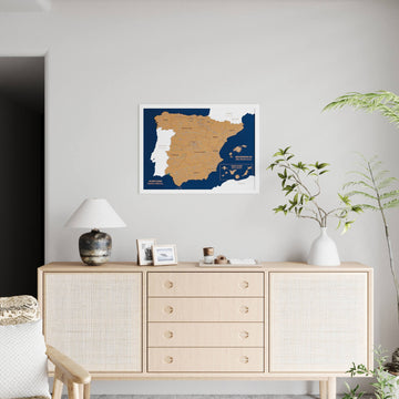 Small white-framed Spain cork map on a light wall, far view with a full rattan sideboard below