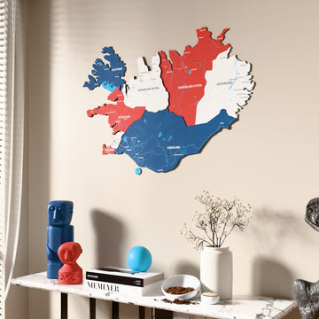 Flag colored Iceland wooden wall map beside a sheer curtain, angled view