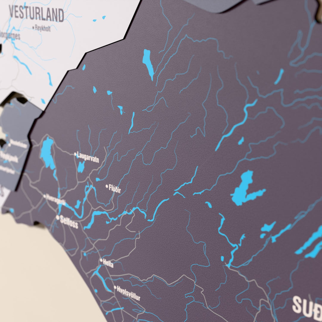 Close-up of the Nimbus Iceland wooden wall map with layered regions and printed names
