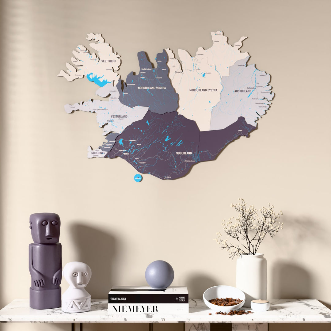 Nimbus Iceland wooden wall map above a marble console, front view