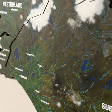 Close-up of the Satellite Iceland wooden wall map with layered regions and printed names