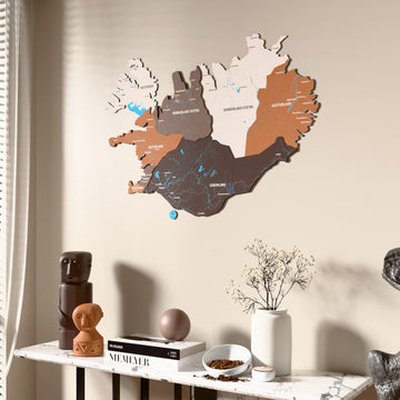 Soil Iceland wooden wall map beside a sheer curtain, angled view