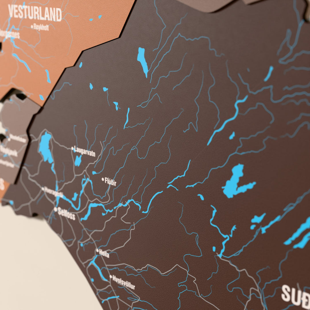 Close-up of the Soil Iceland wooden wall map with layered regions and printed names