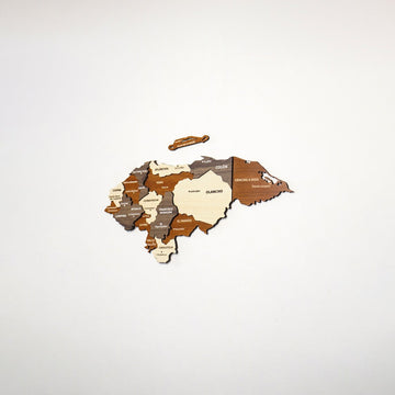 Small wooden Honduras map centered on a white wall, far view with the Bay Islands piece above
