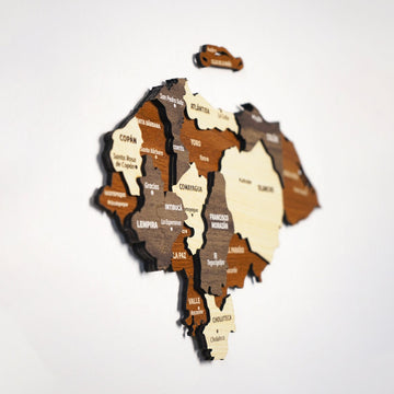 Side-angle view of the layered wooden Honduras map, showing wood depth from Copán to Choluteca