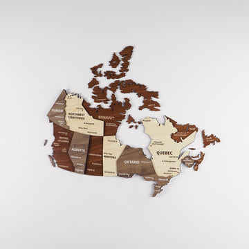 Wooden Canada wall map on a light wall with Hudson Bay cut-out, Yukon and Newfoundland pieces in layered wood