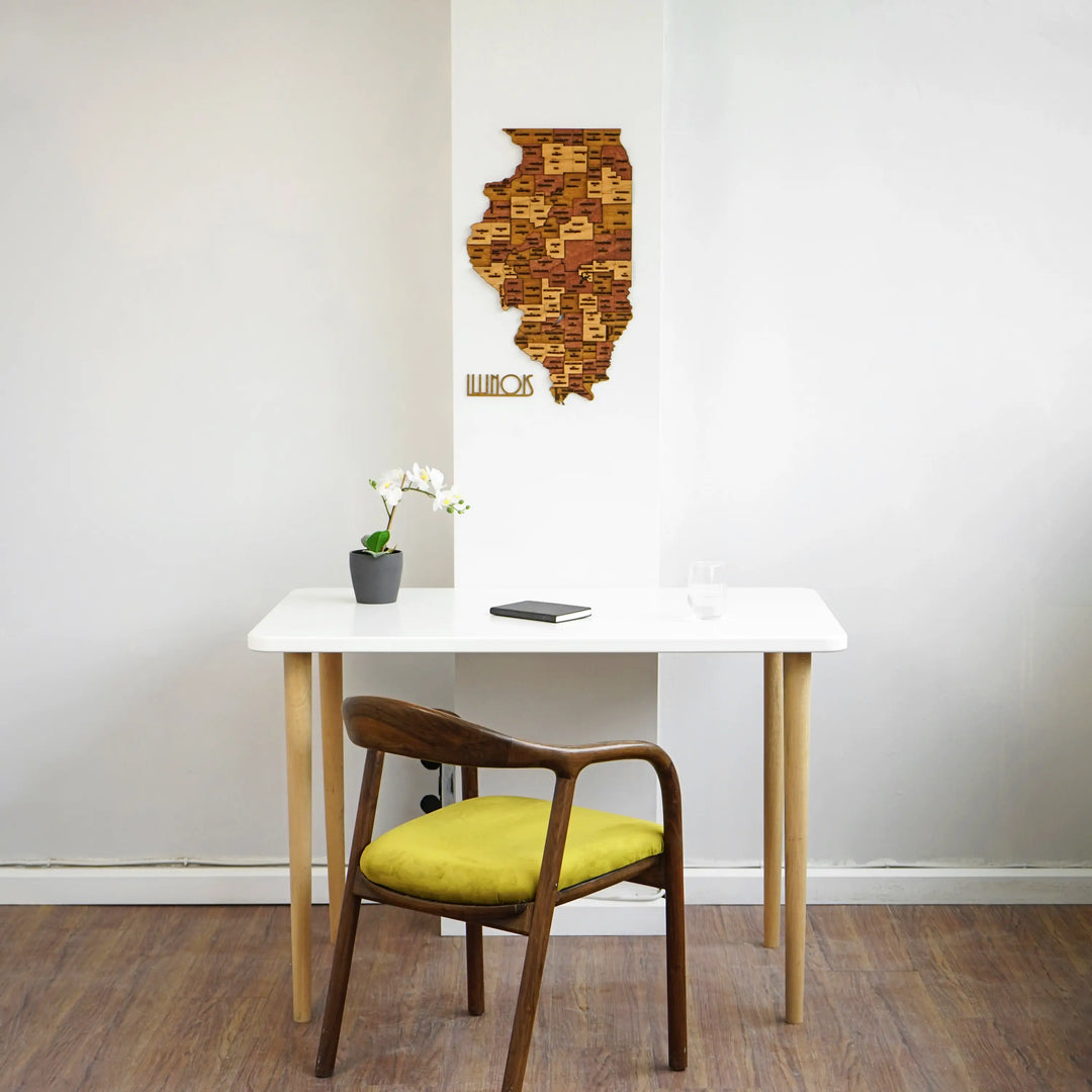 Wooden Illinois wall map above a white desk, wide view with a yellow-cushioned chair